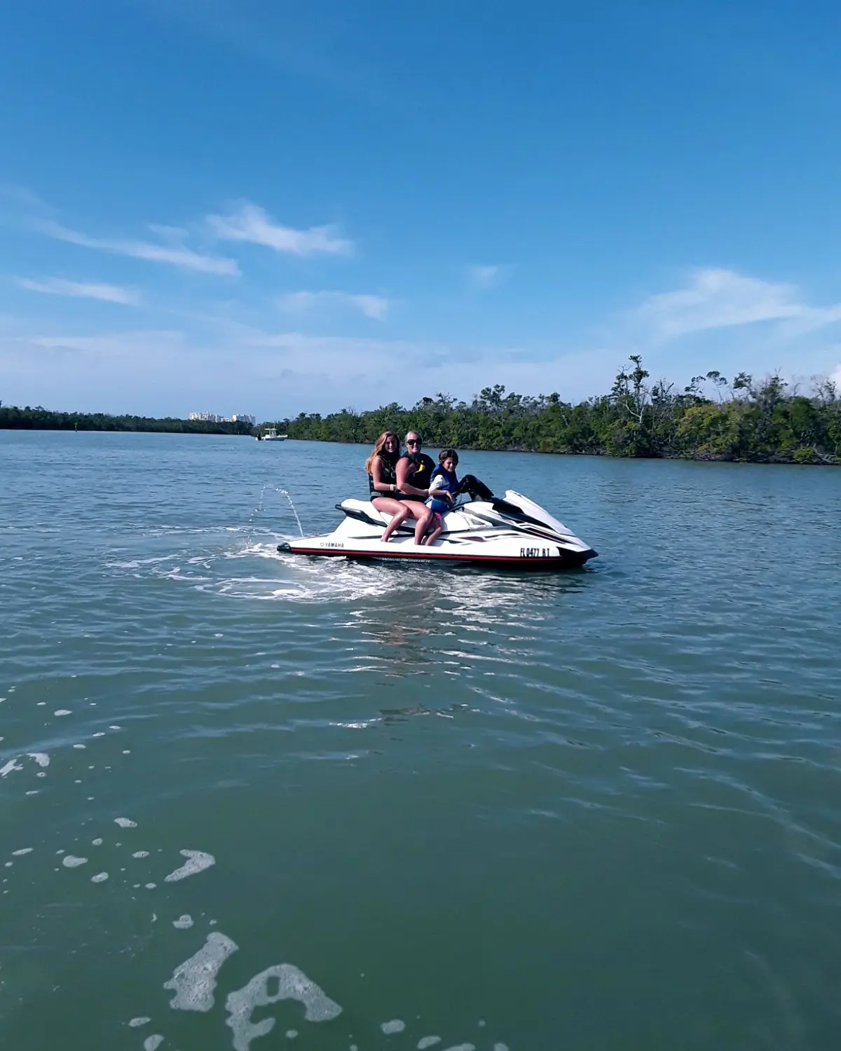 Family of 3 on Jet Ski in Ocean on Marco Island